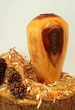 Image of an Damson hollow vessel made by Chris Rymer of Inside Out Wood Art