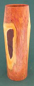 Image of an Plum hollow vessel made by Chris Rymer of Inside Out Wood Art