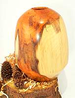 Image of an Yew hollow vessel made by Chris Rymer of Inside Out Wood Art